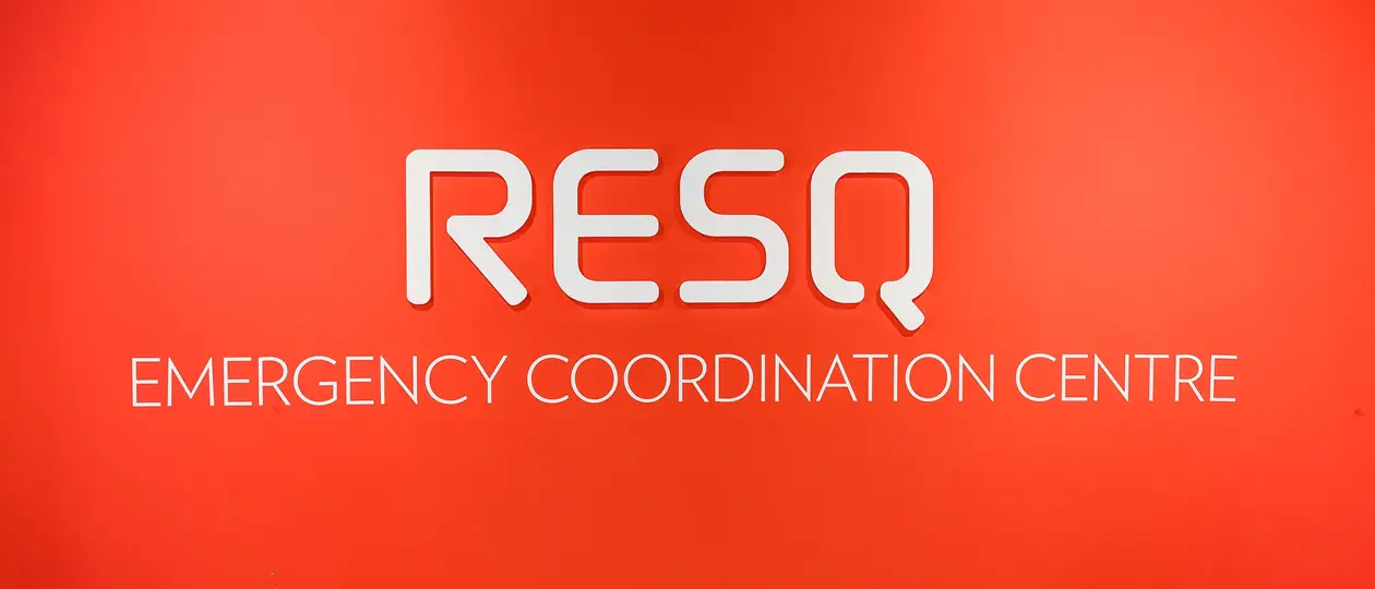 Big white sign that spells R E S Q in a large red background.